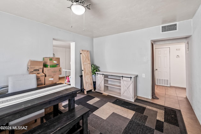 tiled dining space featuring baseboards and visible vents