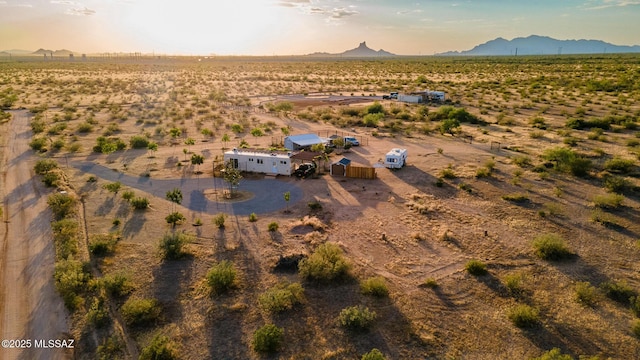 bird's eye view featuring view of desert, a rural view, and a mountain view