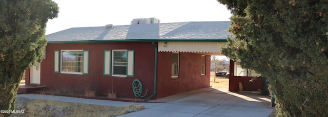 view of property exterior with a chimney