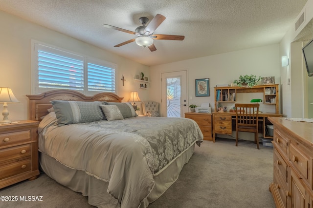 bedroom with a textured ceiling, access to outside, visible vents, and light colored carpet