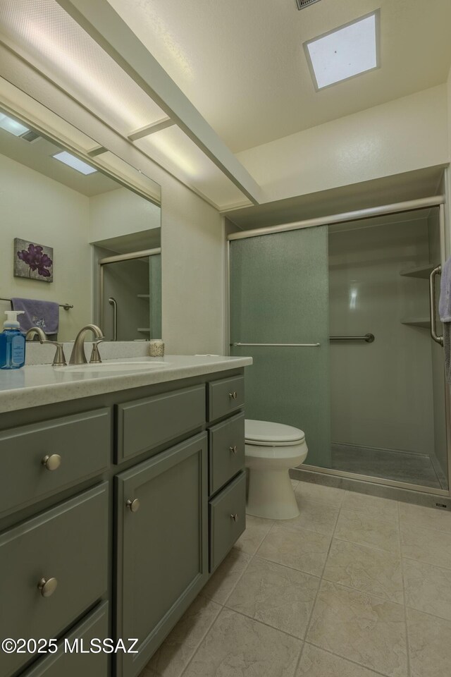 full bath featuring toilet, a stall shower, tile patterned floors, and vanity