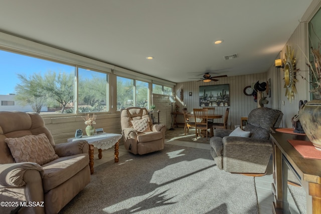 sunroom / solarium with visible vents and ceiling fan