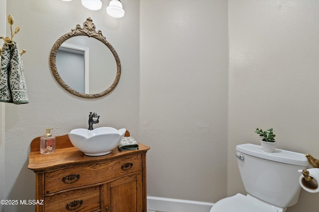 half bath with toilet and vanity