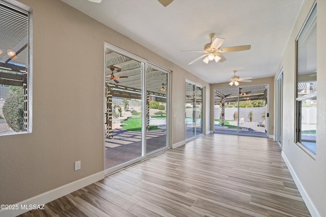 unfurnished sunroom with plenty of natural light