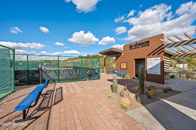 view of home's community with fence