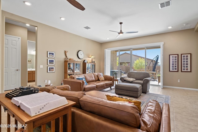 living area with light tile patterned flooring, a ceiling fan, baseboards, visible vents, and recessed lighting