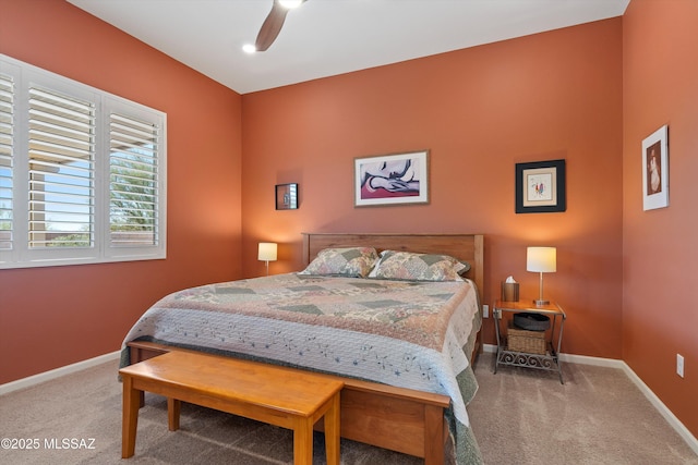 bedroom with carpet, baseboards, and ceiling fan