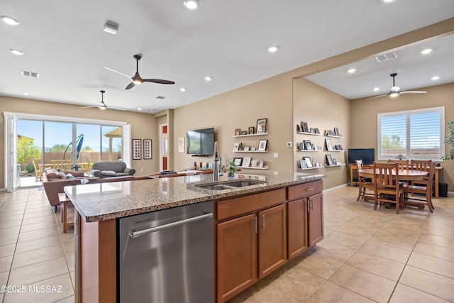 kitchen featuring dishwasher, open floor plan, a sink, and visible vents