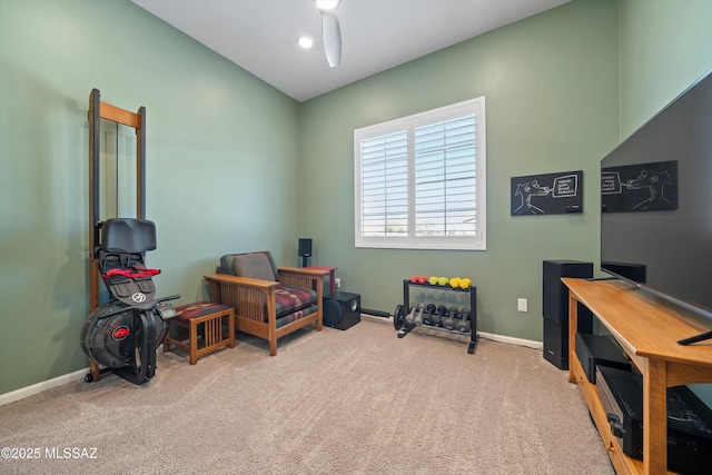 living area with baseboards and carpet floors