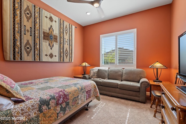 bedroom with a ceiling fan and carpet flooring