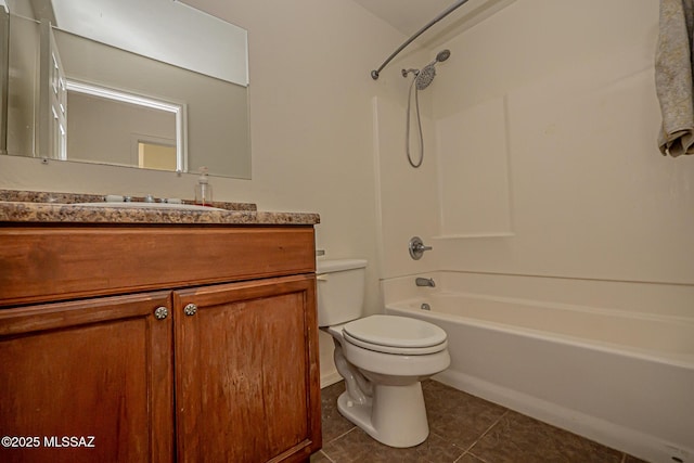 bathroom with tile patterned flooring, bathtub / shower combination, vanity, and toilet