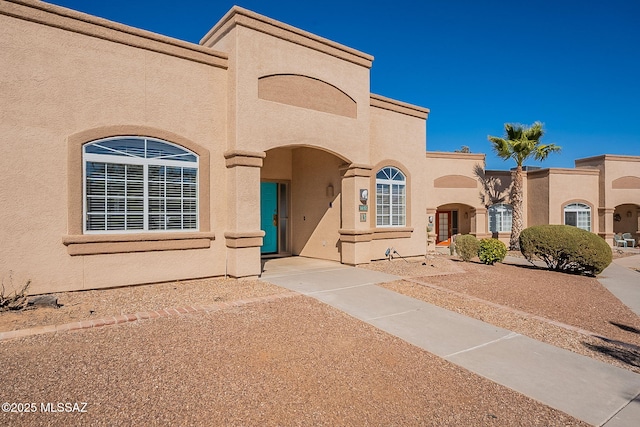 view of front of house featuring stucco siding