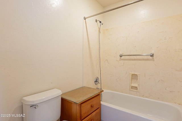 bathroom featuring toilet and bathing tub / shower combination