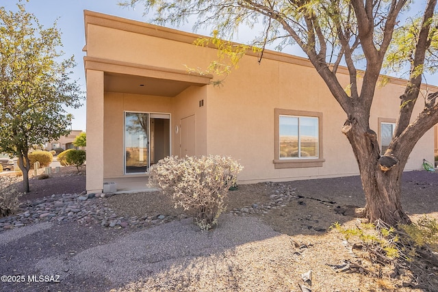 exterior space featuring stucco siding