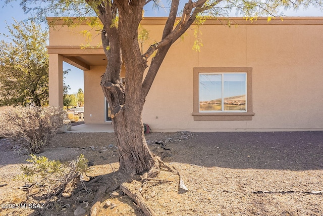 view of property exterior featuring a patio and stucco siding