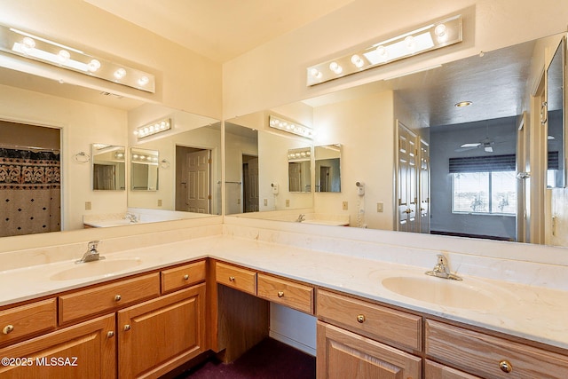 bathroom with vanity and a ceiling fan