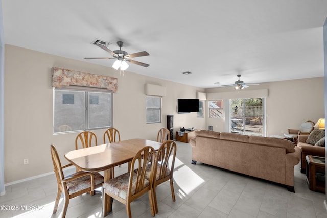 dining area with visible vents, ceiling fan, and baseboards