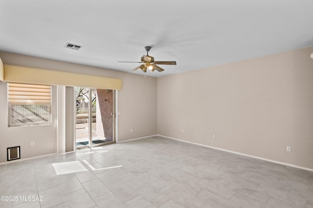 1381 W Camino Buenos Aires, Sahuarita, AZ 85629 - unfurnished room featuring ceiling fan and baseboards