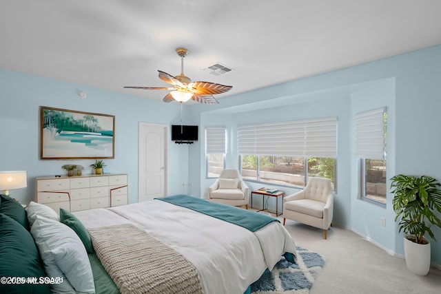 1381 W Camino Buenos Aires, Sahuarita, AZ 85629 - bedroom with light colored carpet, a ceiling fan, and baseboards