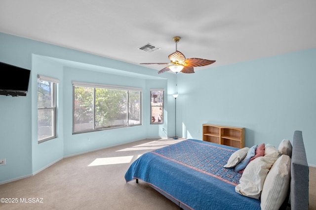 bedroom with ceiling fan, carpet, visible vents, and baseboards