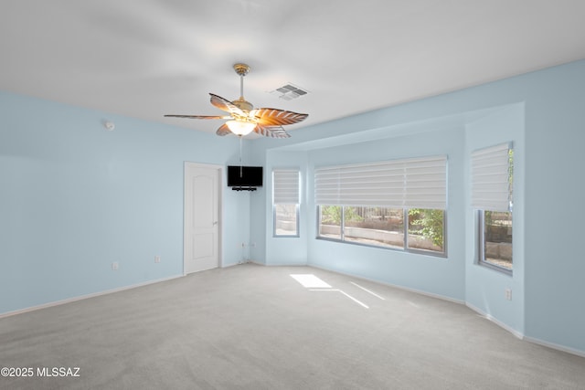 unfurnished bedroom featuring baseboards, a ceiling fan, visible vents, and carpet