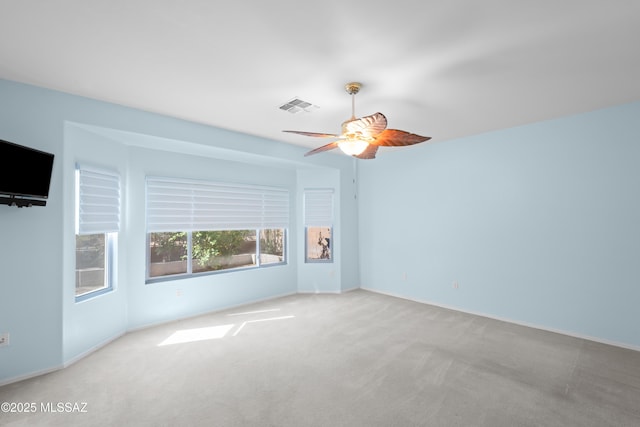 1381 W Camino Buenos Aires, Sahuarita, AZ 85629 - carpeted spare room with a ceiling fan and baseboards