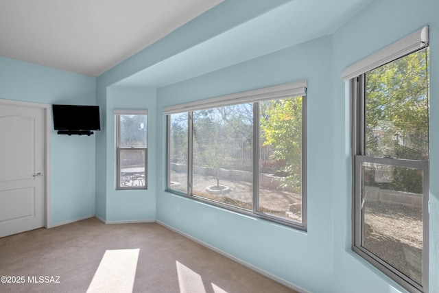 unfurnished bedroom with carpet and baseboards