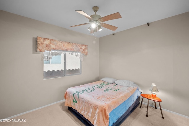 bedroom featuring ceiling fan, carpet flooring, and baseboards