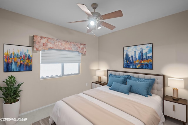 bedroom with baseboards and a ceiling fan
