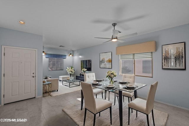 1381 W Camino Buenos Aires, Sahuarita, AZ 85629 - dining room featuring a ceiling fan, baseboards, and recessed lighting