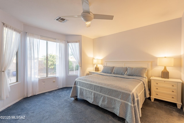 carpeted bedroom with a ceiling fan, visible vents, and baseboards