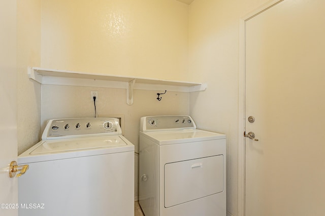 clothes washing area with laundry area and separate washer and dryer