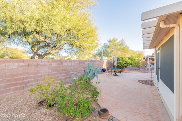 view of patio / terrace with outdoor dining area and a fenced backyard