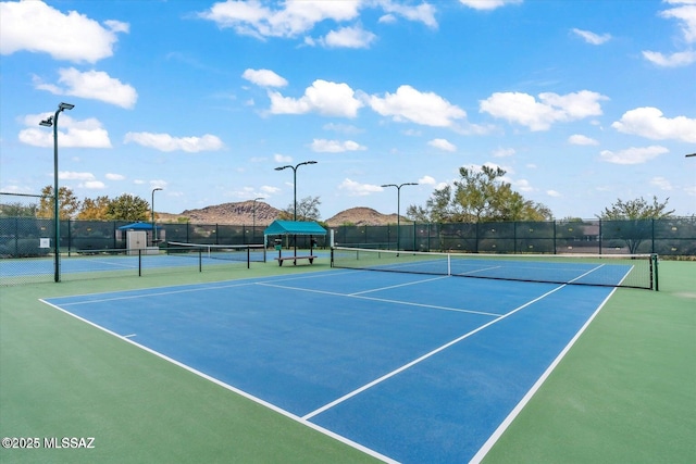 view of sport court featuring community basketball court and fence