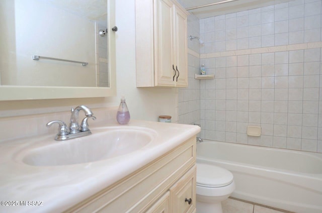 full bathroom featuring tile patterned flooring, bathing tub / shower combination, vanity, and toilet