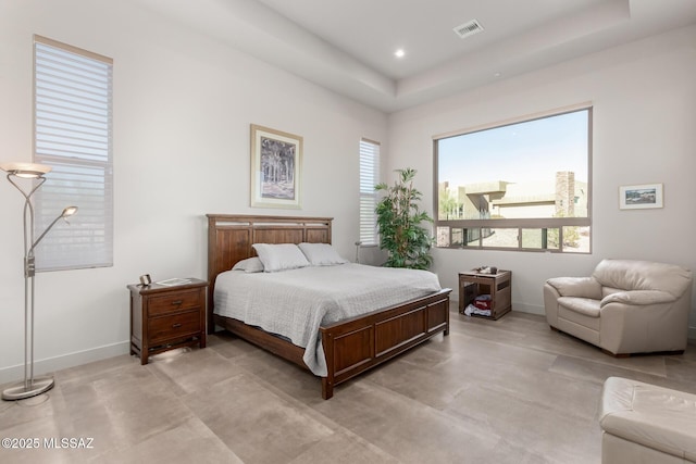 bedroom with baseboards, multiple windows, visible vents, and recessed lighting