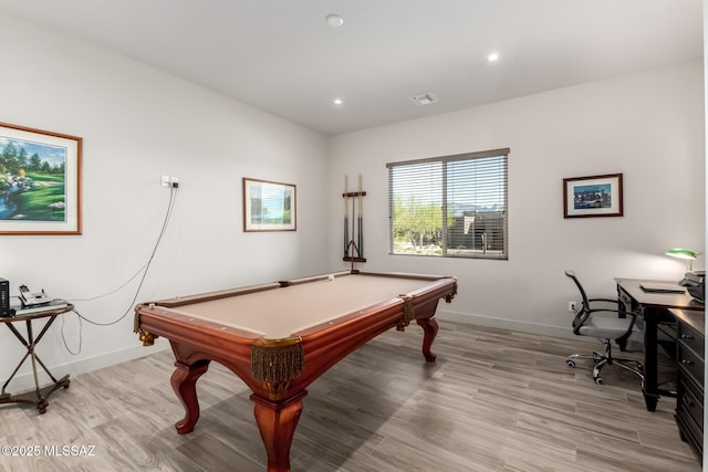 game room featuring baseboards, visible vents, and light wood finished floors