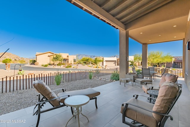 view of patio with outdoor dining area and a fenced backyard