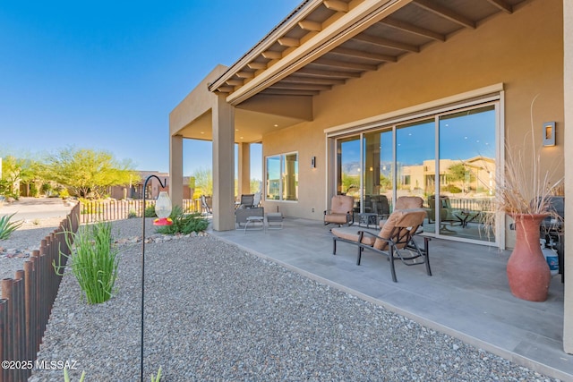 view of patio / terrace featuring fence