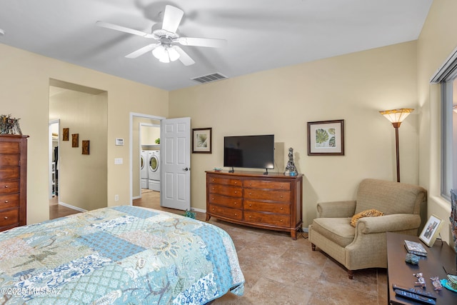 bedroom with a ceiling fan, visible vents, independent washer and dryer, and baseboards