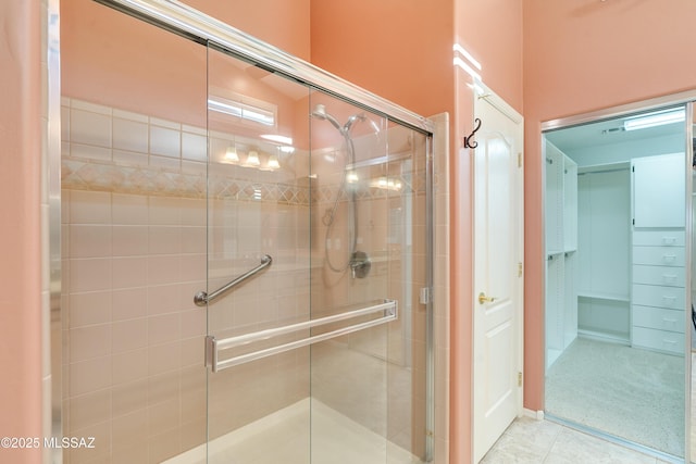 bathroom featuring a stall shower and tile patterned floors