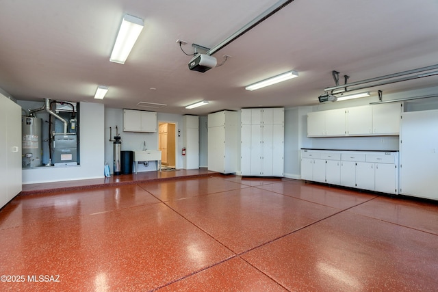 garage featuring a garage door opener, water heater, a sink, and heating unit