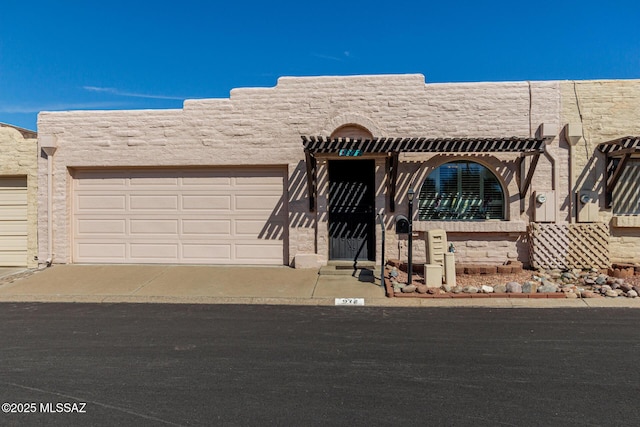 view of front of home featuring a garage and concrete driveway