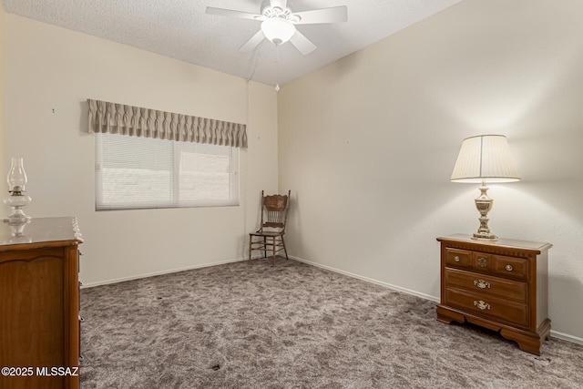 unfurnished bedroom featuring carpet floors, a textured ceiling, and baseboards