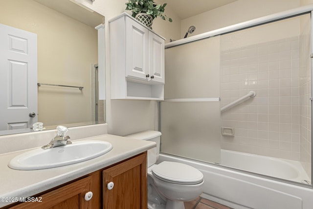 bathroom featuring shower / bath combination with glass door, vanity, and toilet