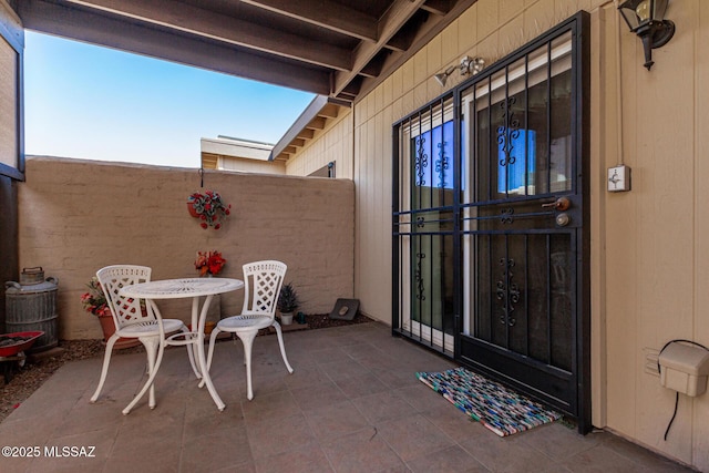 view of patio / terrace featuring fence