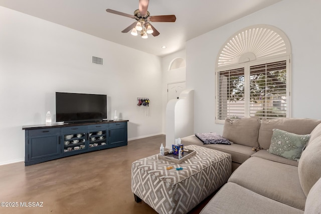 living room featuring visible vents, baseboards, ceiling fan, finished concrete floors, and recessed lighting