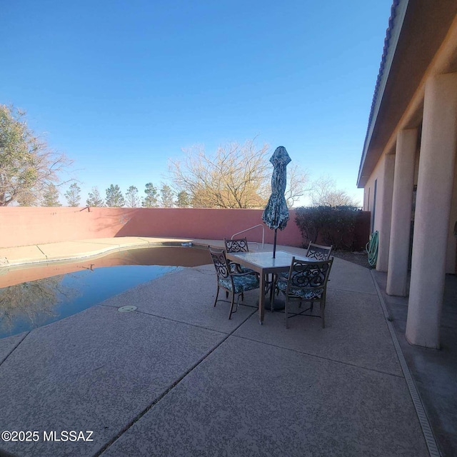 view of patio / terrace with outdoor dining area and a fenced backyard