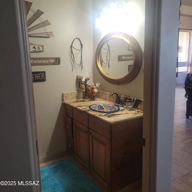 bathroom featuring tile patterned flooring and vanity