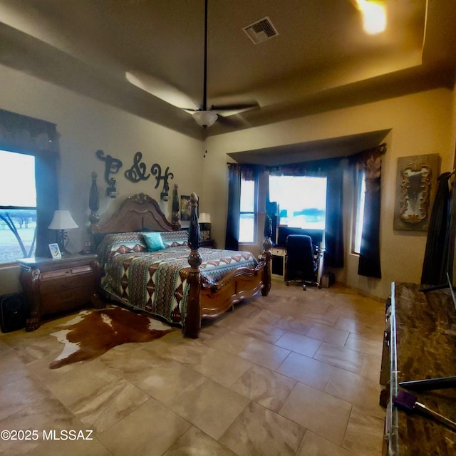 bedroom featuring visible vents and a ceiling fan